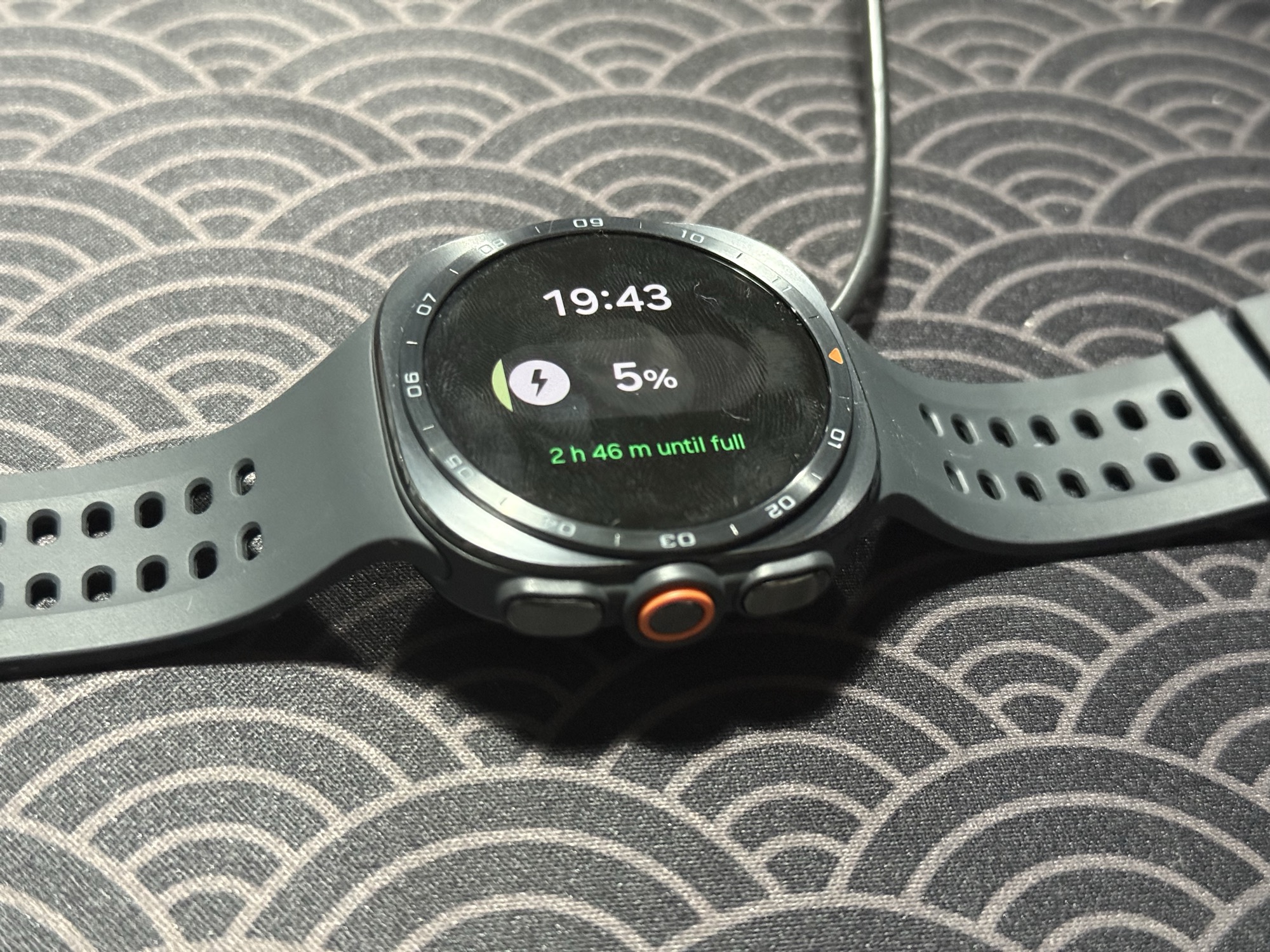 The Galaxy Watch Ultra 2 charging, showing time remaining until full