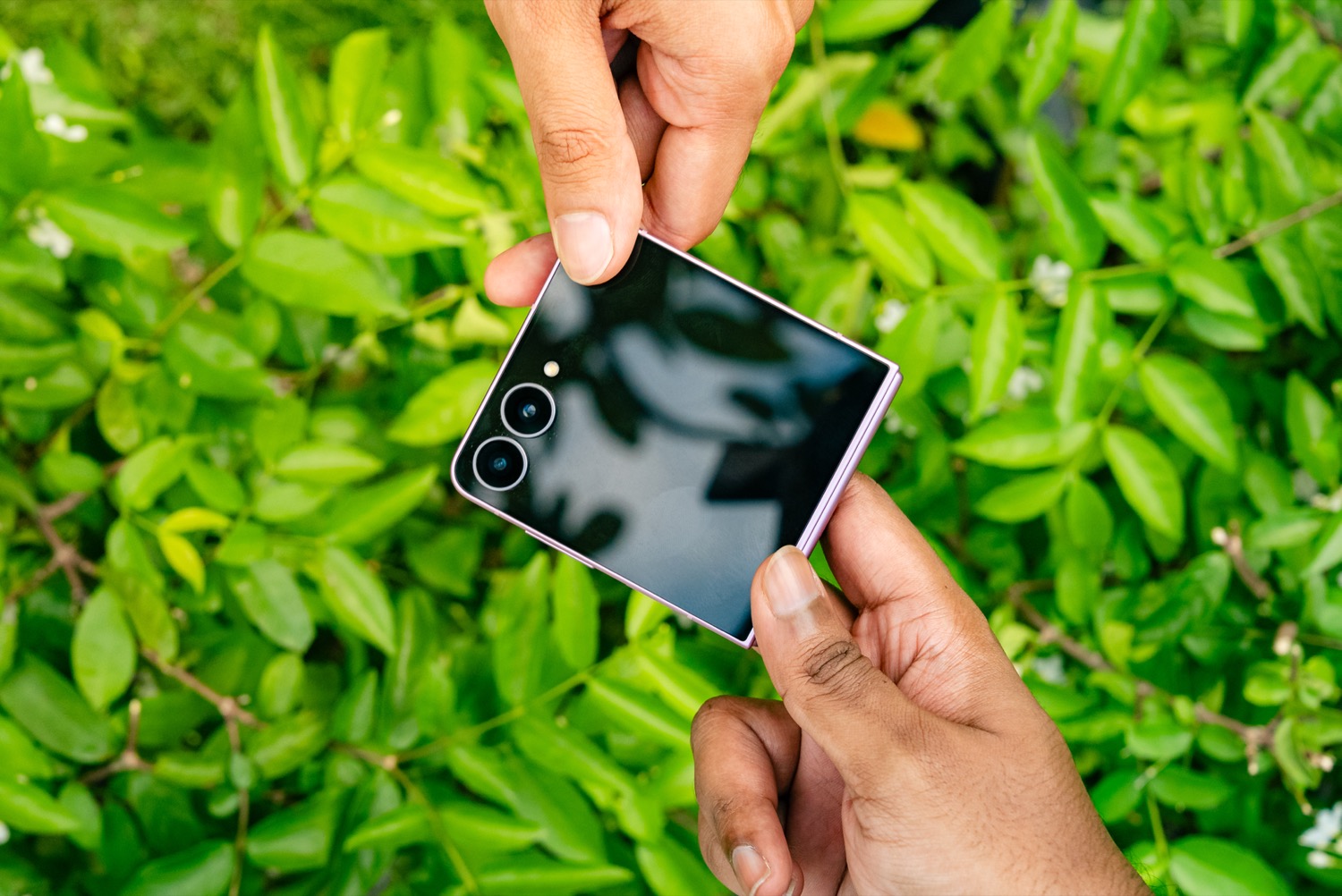 The Samsung Galaxy Z Flip8 folded shut and held in two hands, showing its dual rear cameras The Samsung Galaxy Z Flip8 folded shut and held in two hands, showing its dual rear cameras