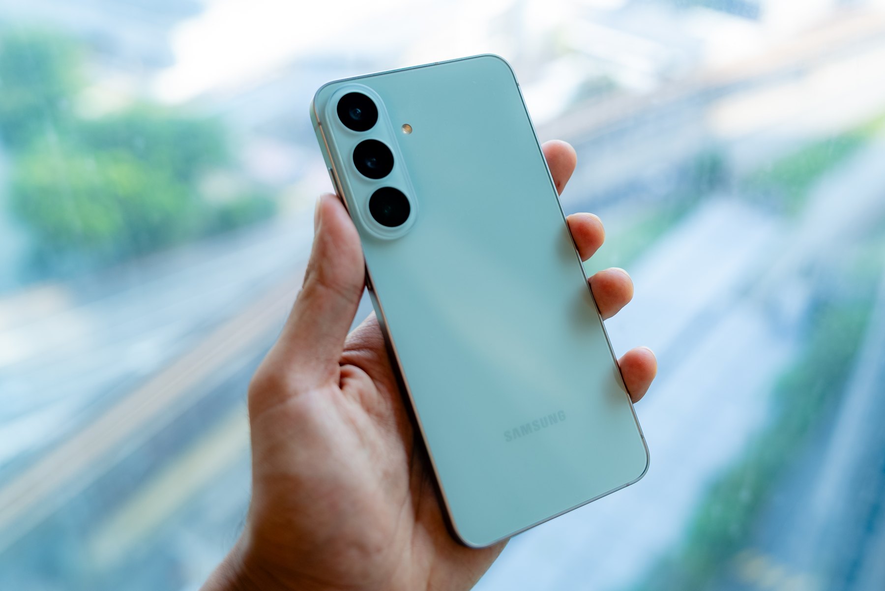 The Pistachio S26 FE, held one-handed at our office window. Photo by ProductNation. The Pistachio S26 FE, held one-handed at our office window. Photo by ProductNation.