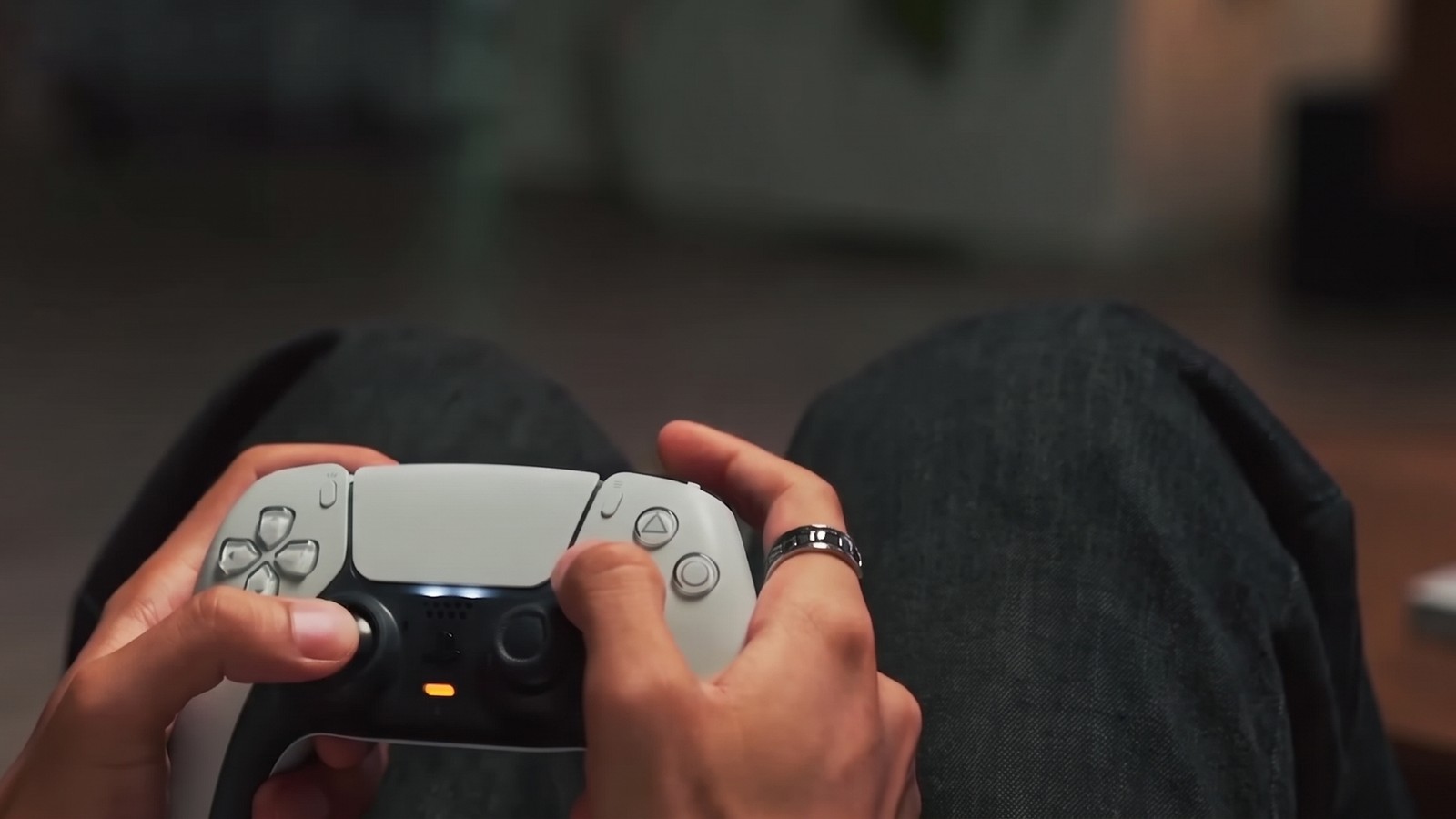 Gaming on the XGIMI Horizon 20 Pro Playing on a PS5 controller in front of the XGIMI Horizon 20 Pro picture