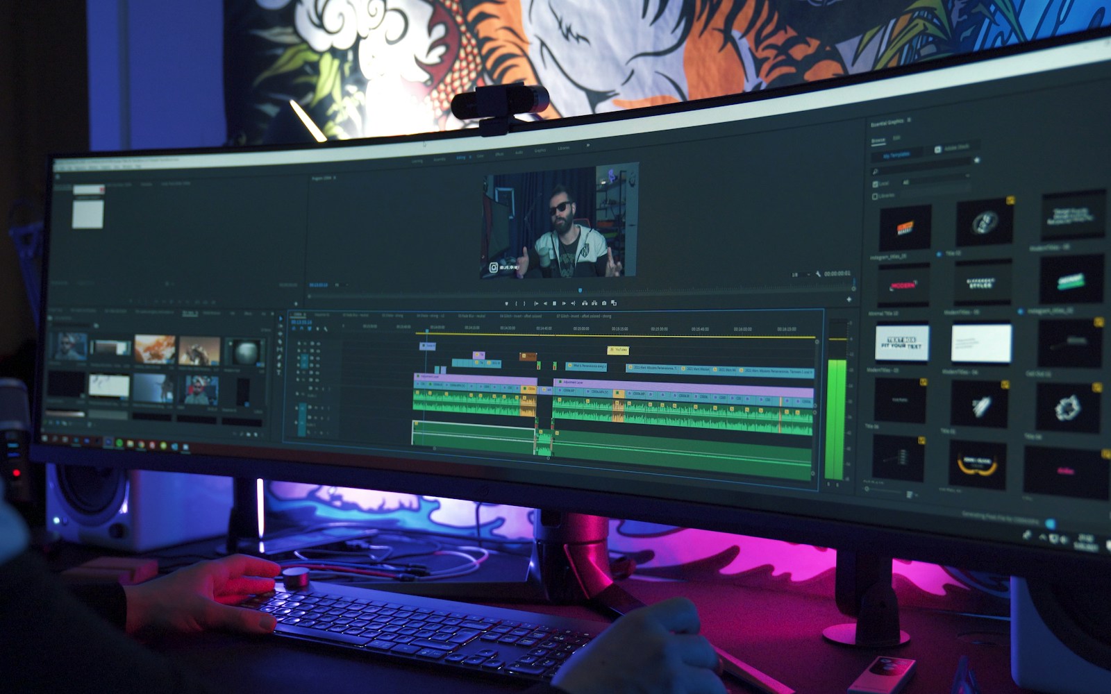 A video editor working at a desktop computer
