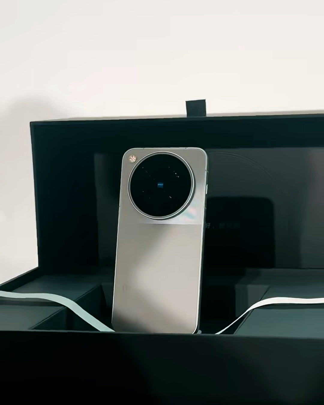 Unboxing the vivo X500 Pro Max, its circular ZEISS camera module visible in the tray Unboxing the vivo X500 Pro Max, its circular ZEISS camera module visible in the tray