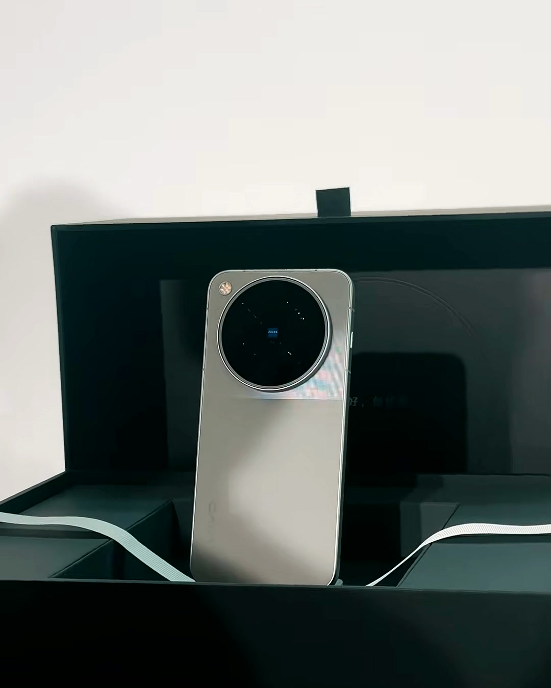 Unboxing the vivo X500 Pro Max, its circular ZEISS camera module visible in the tray Unboxing the vivo X500 Pro Max, its circular ZEISS camera module visible in the tray