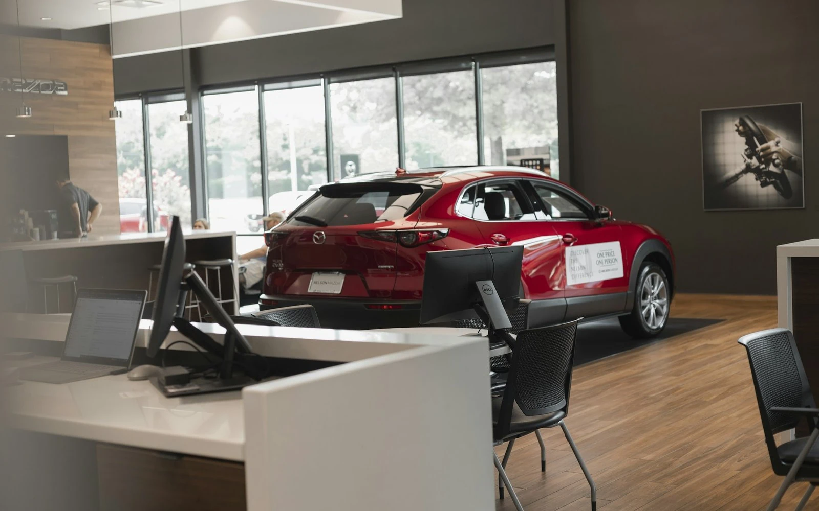New cars on display inside a dealership showroom