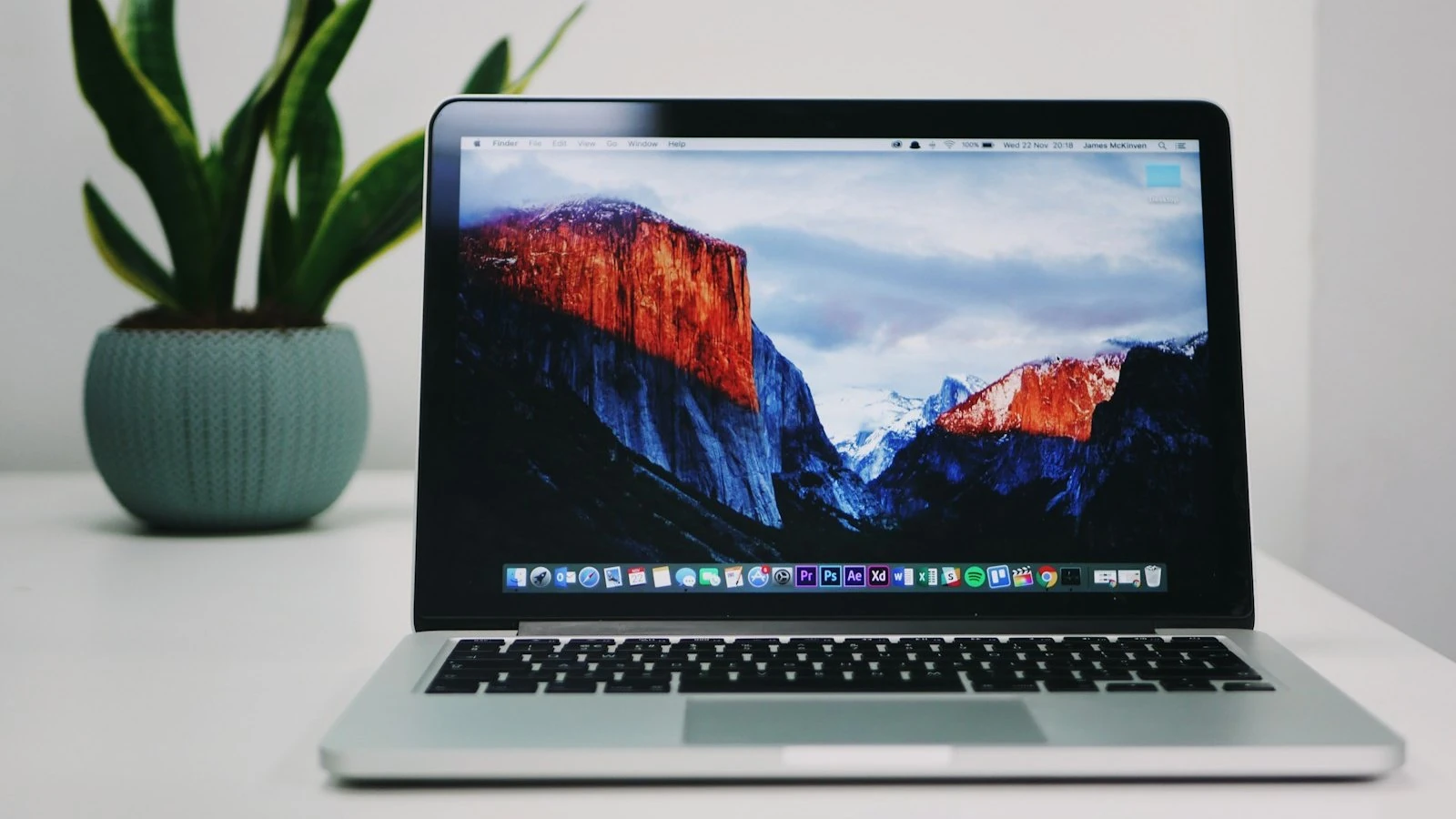 An open laptop on a work desk