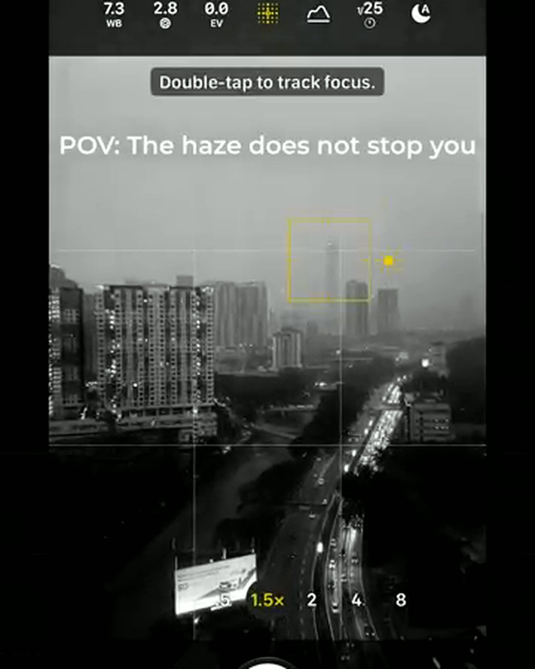 iPhone 18 Pro Camera app manual readout showing f/2.8 variable aperture while framing the hazy KL skyline iPhone 18 Pro Camera app manual readout showing f/2.8 variable aperture while framing the hazy KL skyline