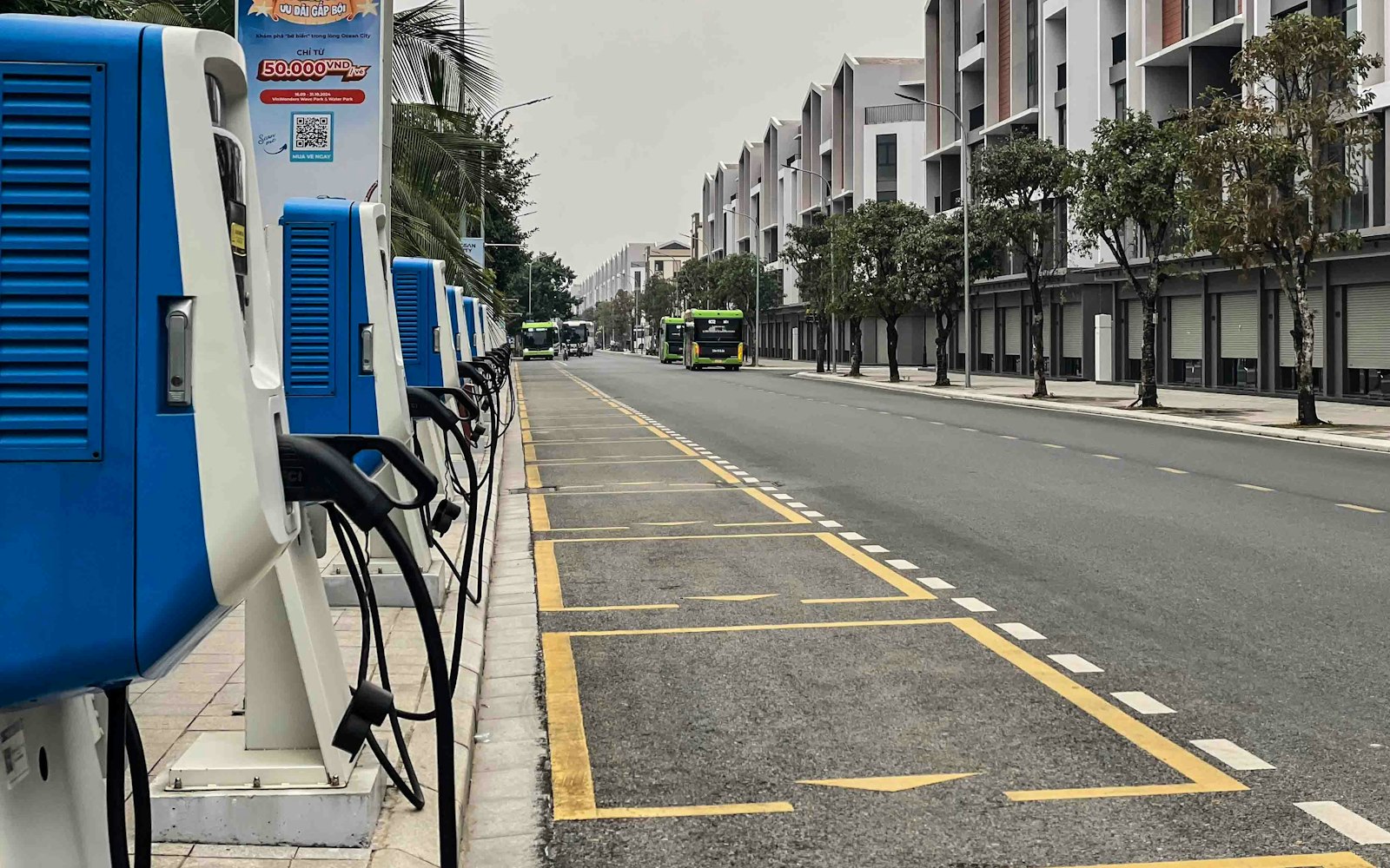 A row of electric vehicle charging stations along a city street