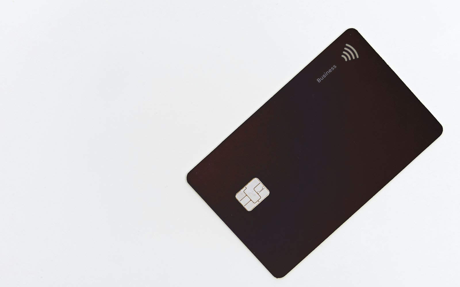 A generic payment card showing an EMV chip and a contactless NFC symbol, illustrating a dual-interface smart card