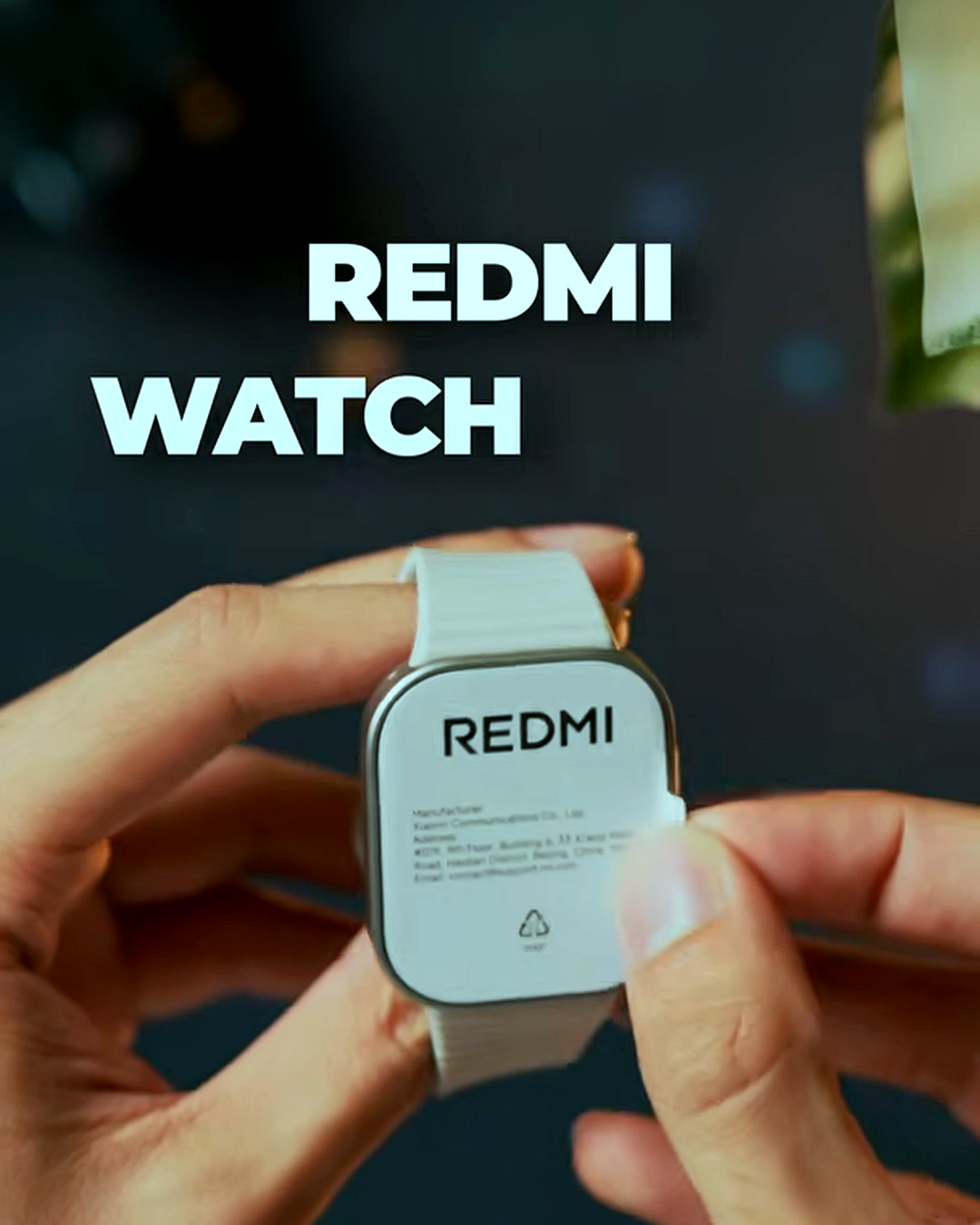Unboxing the Redmi Watch 6 Lite, showing the Redmi branding on the back of the case