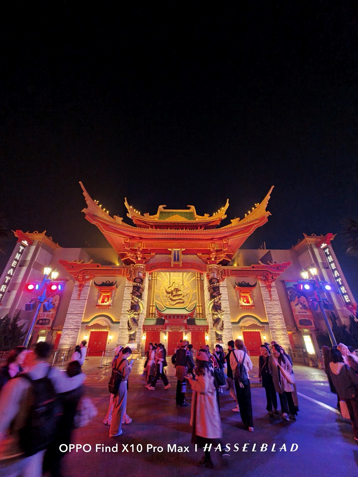 Lit Chinese gateway at night with a crowd, shot on the OPPO Find X10 Pro Max ultra-wide camera