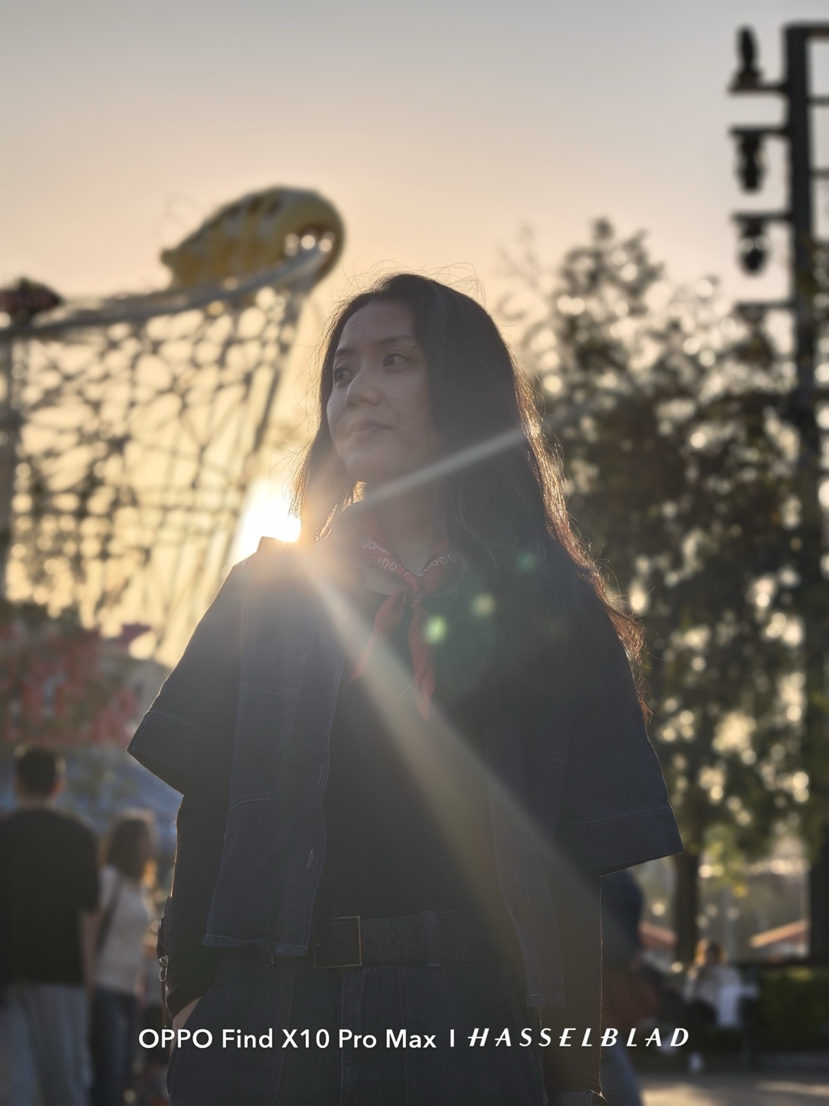 Backlit portrait of a woman at sunset shot in portrait mode on the OPPO Find X10 Pro Max