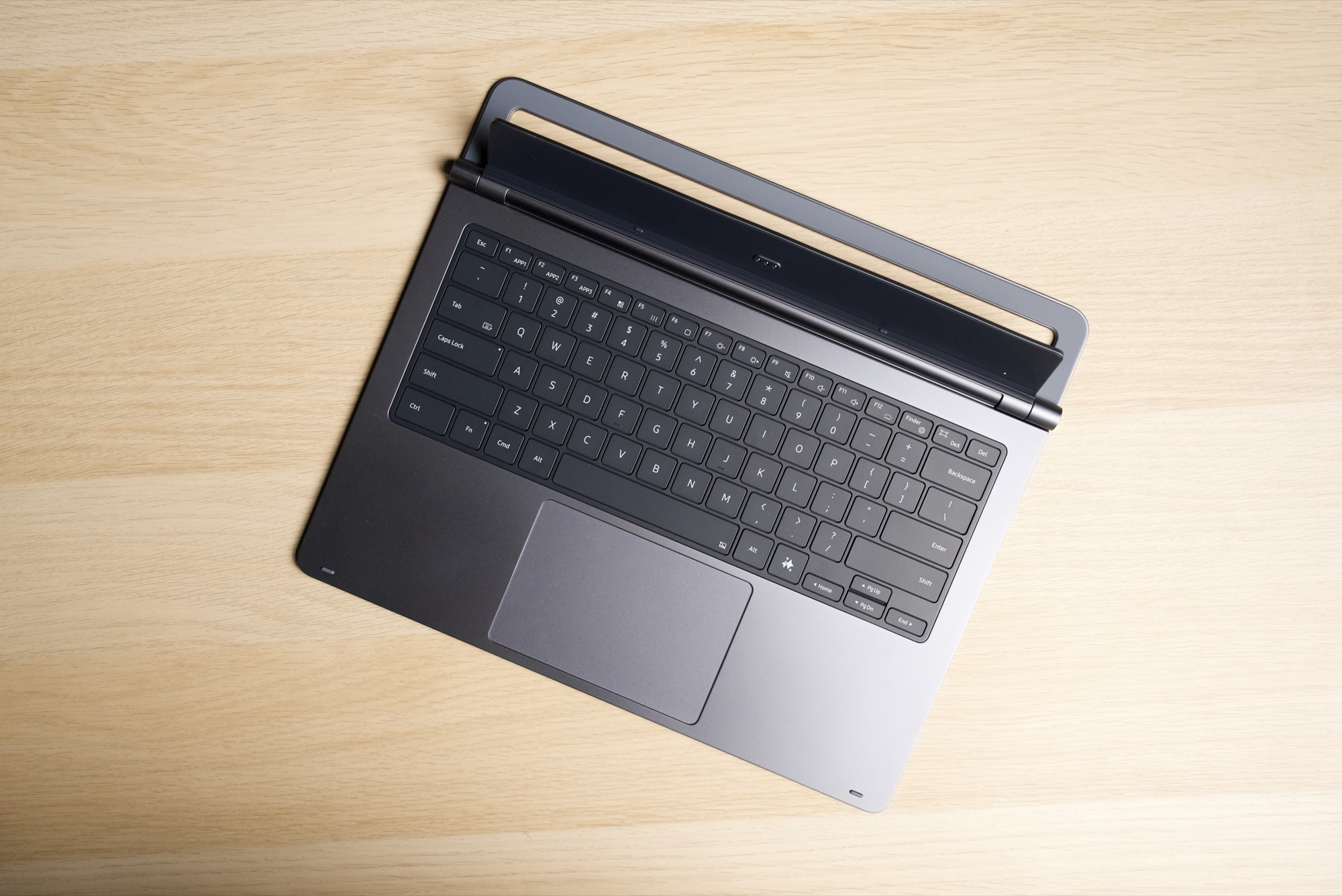 Top-down view of the Pro Keyboard on its own, showing the keys, the trackpad, the hinge bar and the cradle frame