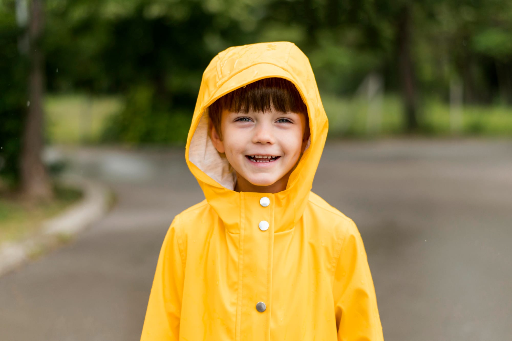 little-kid-smiling-rain-coat.jpg