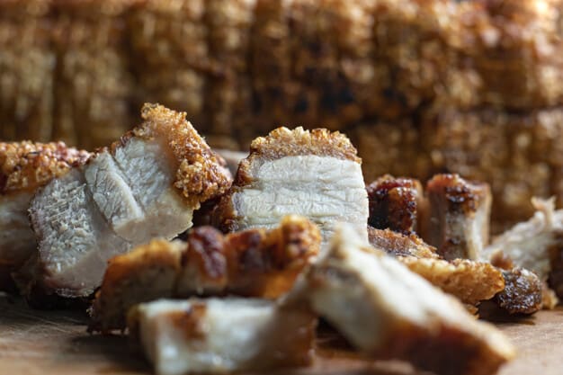 close-up-oriental-roast-crispy-pork-belly-wooden-chopping-board_228338-150.jpg