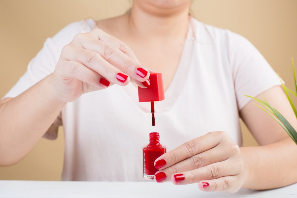 woman-s-nails-with-red-nail-polish.jpg