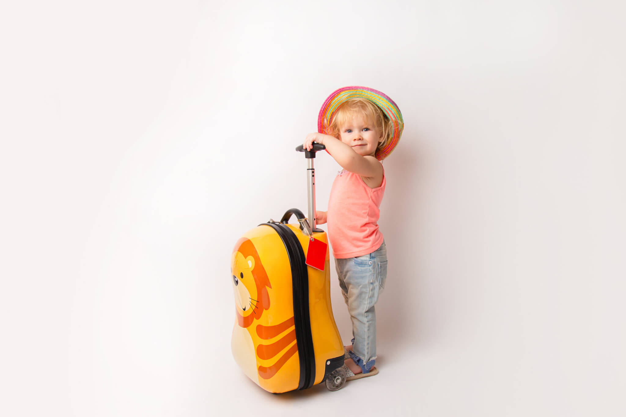 Young-child-carrying-kids-luggage-scaled.jpg